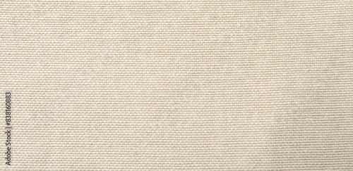 Texture of beige fabric as background, top view photo
