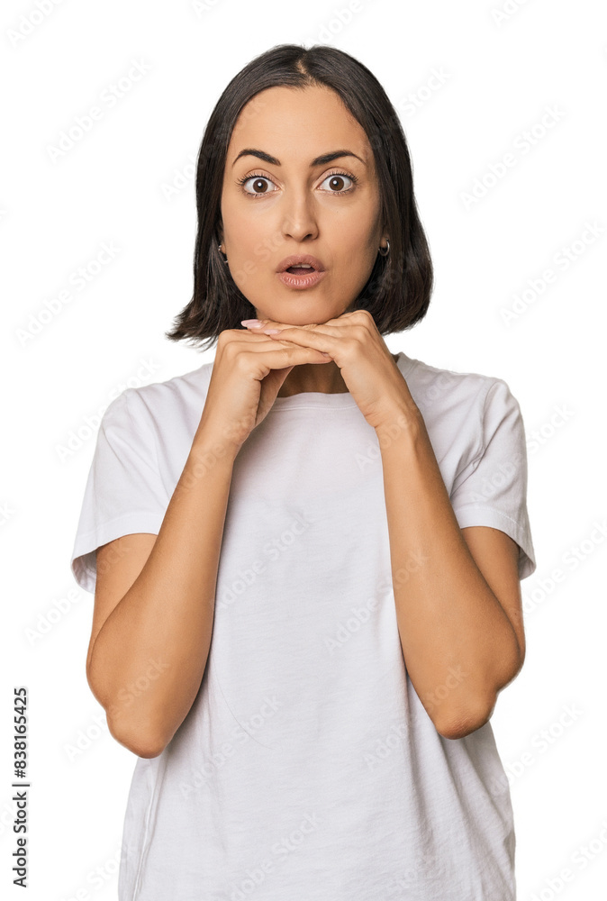 Young Caucasian woman with short hair praying for luck, amazed and opening mouth looking to front. Young Caucasian woman with short hair praying for luck, amazed and opening mouth looking to front.