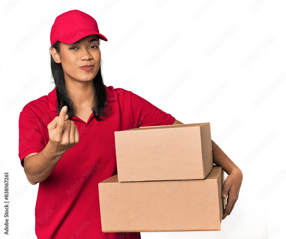 Young Filipina courier with two packages pointing with finger at you as if inviting come closer. Young Filipina courier with two packages pointing with finger at you as if inviting come closer.