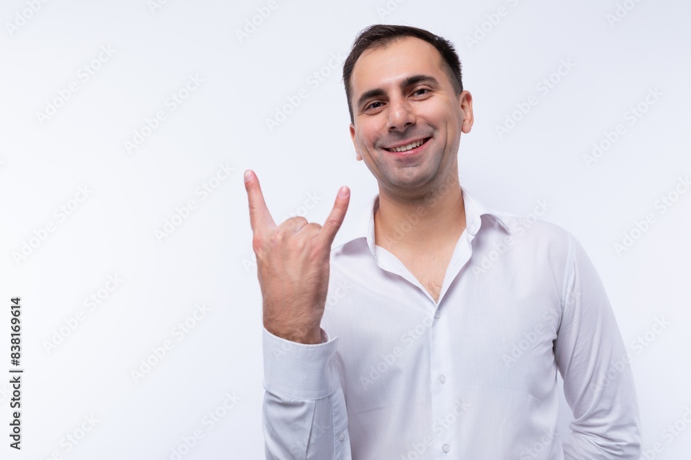 Confident brunette office man in a white shirt actively gesturing Confident brunette office man in a white shirt actively gesturing