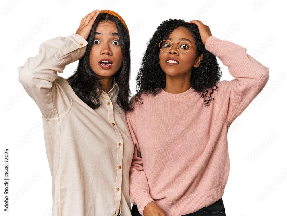Young Latin friends together in studio being shocked, she has remembered important meeting. Young Latin friends together in studio being shocked, she has remembered important meeting.