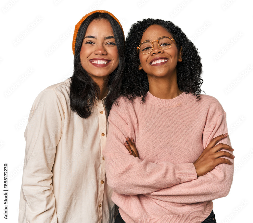Young Latin friends together in studio who feels confident, crossing arms with determination. Young Latin friends together in studio who feels confident, crossing arms with determination.