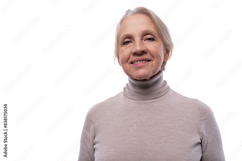 Granny with gray hair smiling sweetly in studio with white background Granny with gray hair smiling sweetly in studio with white background