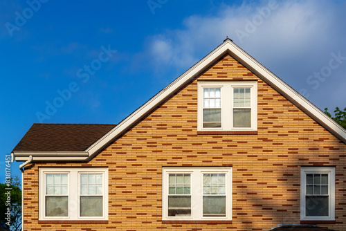 Yellow and brown bricks: Harmonious facade of a family house in Brighton, Massachusetts, USA