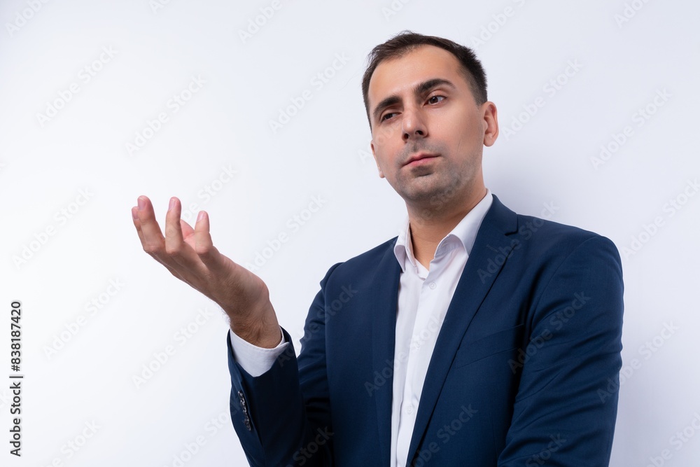 Portrait of a puzzled business man in a blue jacket on a white background Portrait of a puzzled business man in a blue jacket on a white background