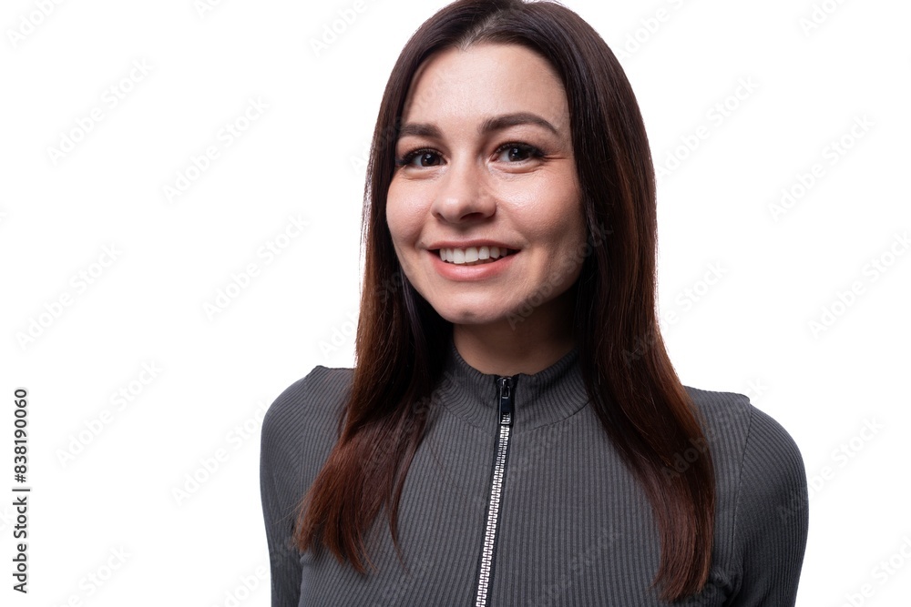 Young friendly woman with black hair isolated on clean white background Young friendly woman with black hair isolated on clean white background