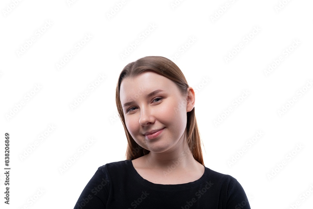 School-age girl with brown hair close-up on a white background with copy space School-age girl with brown hair close-up on a white background with copy space