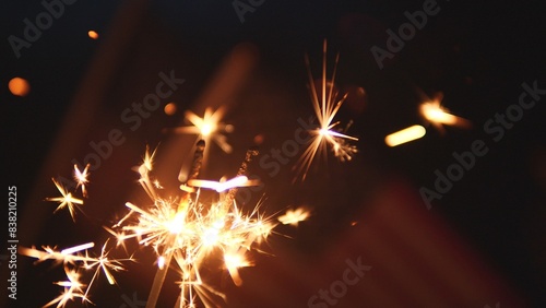 Sparkler Firework Celebration. Holding Sparkler Firework Celebration with USA American Flag, outdoor dark background. Concept Veterans Day, Remembrance Day, fourth of July, Freedom, Independence Day