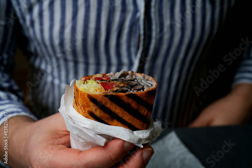 Burrito in the hand of a man
