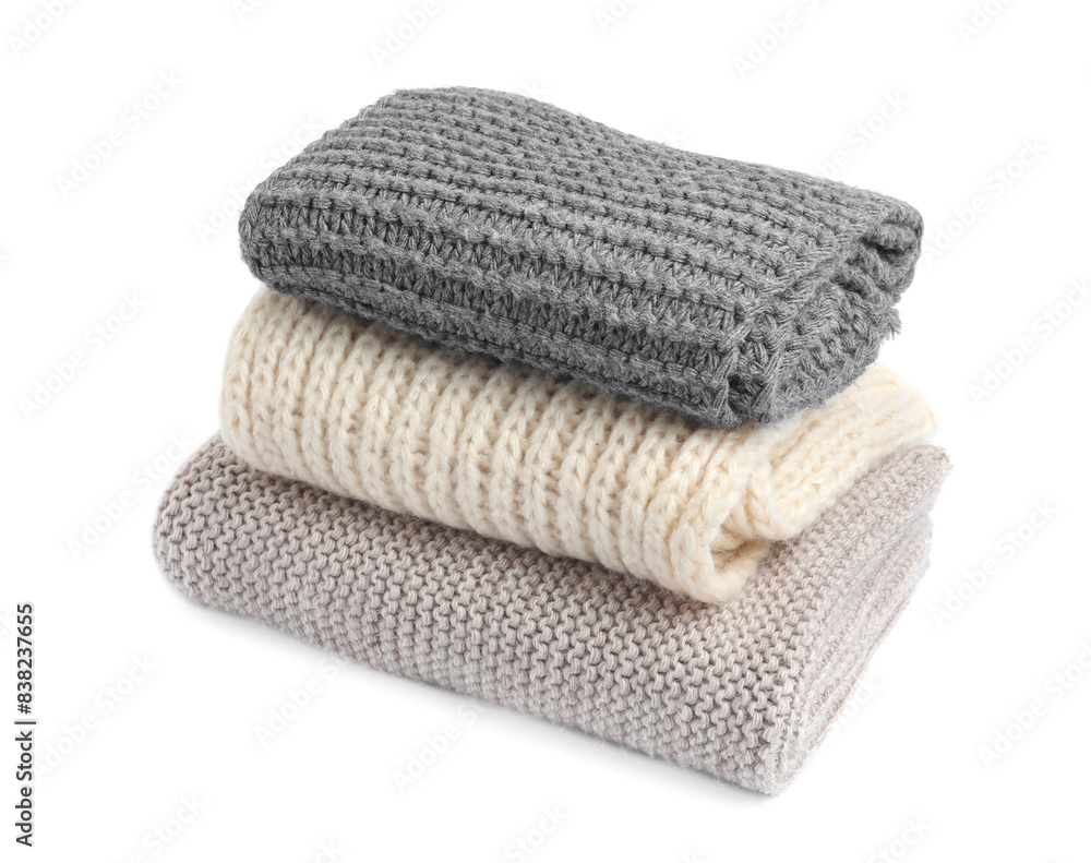Stack of knitted scarfs on white background Stack of knitted scarfs on white background