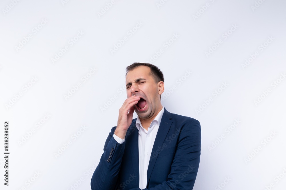 European 40 year old business man dressed in a jacket is bored European 40 year old business man dressed in a jacket is bored