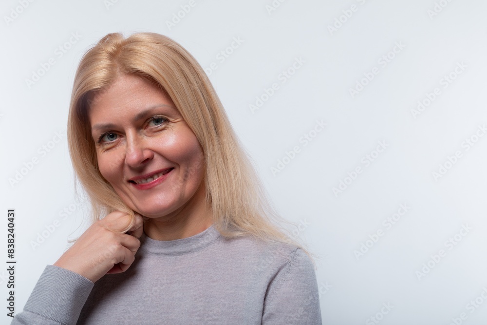 European woman with blond hair gives a friendly welcome on a white background European woman with blond hair gives a friendly welcome on a white background