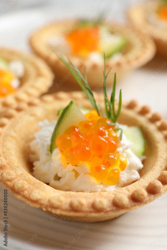 Delicious canapes with red caviar on plate, closeup Delicious canapes with red caviar on plate, closeup