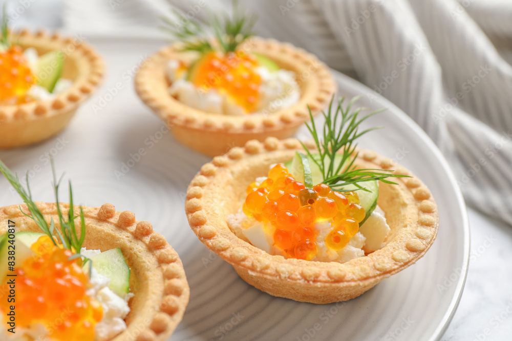 Delicious canapes with red caviar on table, closeup Delicious canapes with red caviar on table, closeup