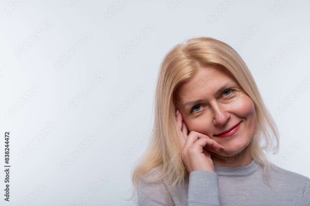 Smiling Caucasian 45 year old woman with blond hair close-up, portrait Smiling Caucasian 45 year old woman with blond hair close-up, portrait