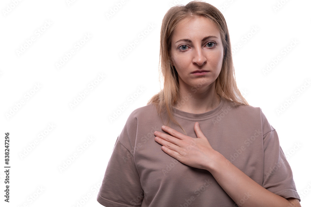 Portrait of a European 40 year old woman with flowing blonde hair on a white background
