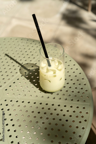 Close-up of an iced Matcha latte on a table in a cafe