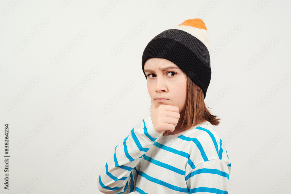 Cute boy thinking and looking aside, over white background. Thoughtful clever schooler. Student with serious expression, child thinking doubting, making choice. Cute boy thinking and looking aside, over white background. Thoughtful clever schooler. Student with serious expression, child thinking doubting, making choice.