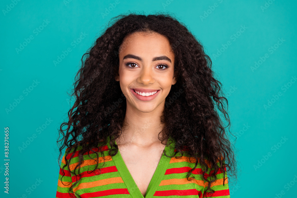 Photo portrait of attractive young woman look camera dressed stylish striped clothes isolated on aquamarine color background Photo portrait of attractive young woman look camera dressed stylish striped clothes isolated on aquamarine color background