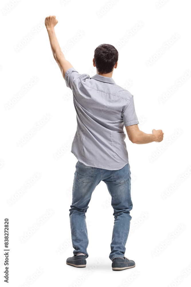 Rear view shot of a happy young man with arms up Rear view shot of a happy young man with arms up