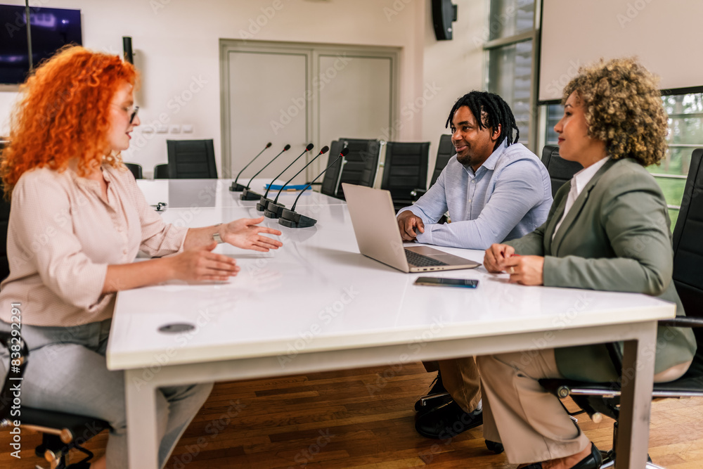 Human resource team talking to a candidate during a job interview in the office. Human resource team talking to a candidate during a job interview in the office.