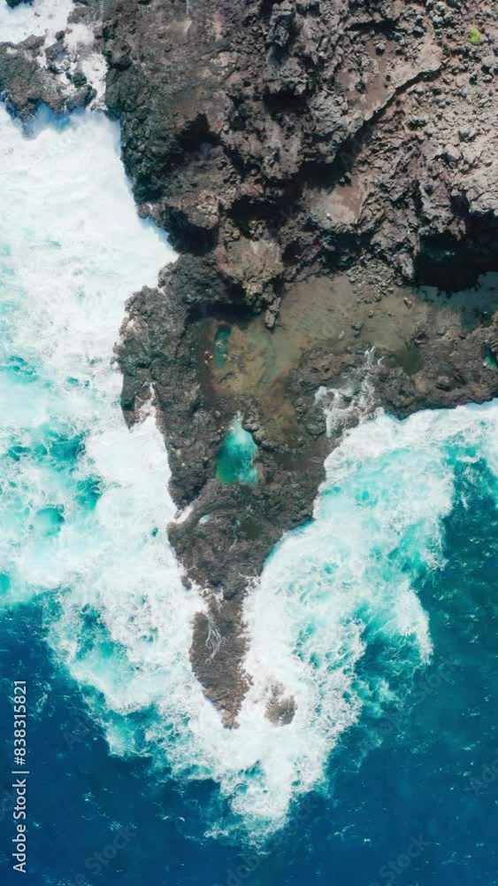 Vertical Screen: The Hawaiian coastline boasts rugged beauty with turquoise waves, perfect for photography and exploration. The aerial view perfectly captures the essence of this wild paradise Vertical Screen: The Hawaiian coastline boasts rugged beauty with turquoise waves, perfect for photography and exploration. The aerial view perfectly captures the essence of this wild paradise