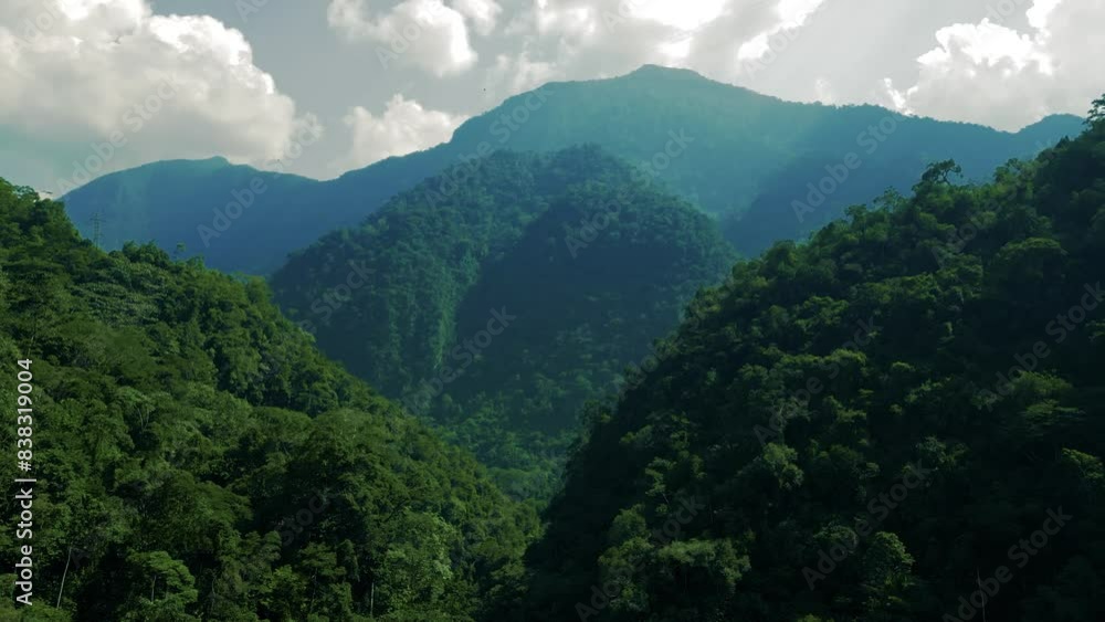 majestic green mountains full of lush trees and unspoiled nature in South America during a sunny summer day majestic green mountains full of lush trees and unspoiled nature in South America during a sunny summer day