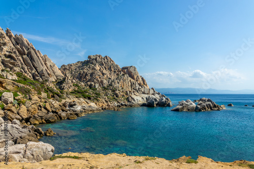 View of a small cove  or cala  on the rocky mediterranean coast in Capo Testa  Sardinia  Italy
