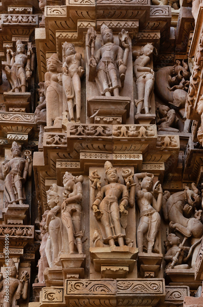 Ancient sculptures designed on the wall of Kandariya Mahadeva Temple in the Khajuraho temple complex, India Ancient sculptures designed on the wall of Kandariya Mahadeva Temple in the Khajuraho temple complex, India