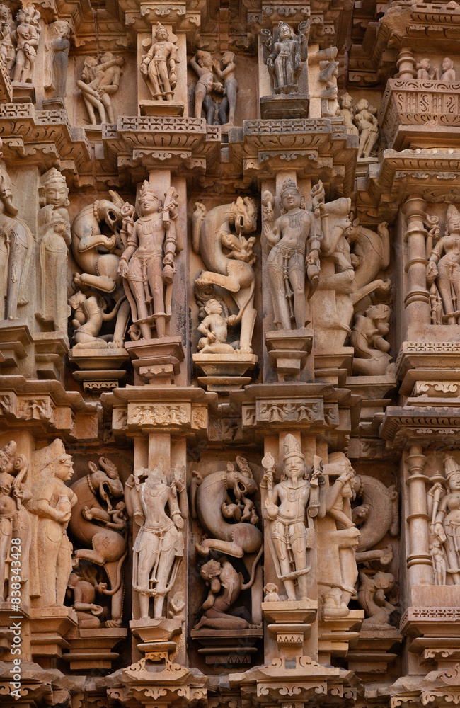 Ancient sculptures that includes Vyalas with face of lion on the wall of Kandariya Mahadeva Temple in the Khajuraho temple complex, Indiae complex, India Ancient sculptures that includes Vyalas with face of lion on the wall of Kandariya Mahadeva Temple in the Khajuraho temple complex, Indiae complex, India