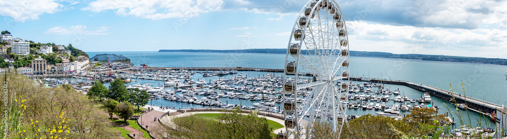 Fototapeta premium Torquay wide panoramic landscape image of the big wheel and marina. Popular tourist location.