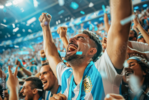 Argentine football soccer fans in a stadium supporting the national team, Albiceleste, Gauchos
