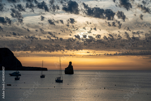 Sunset on Benirras beach in Ibiza in summer photo