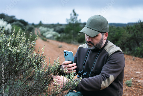 Obraz na plátně Ecologist park ranger working on the National park Reserve monitoring plant heal