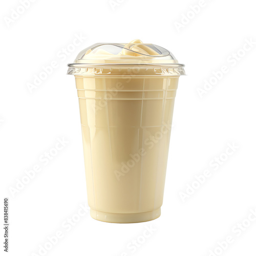 Plastic cup filled with creamy vanilla milkshake, topped with whipped cream, isolated on a white background. Refreshing and sweet beverage. photo