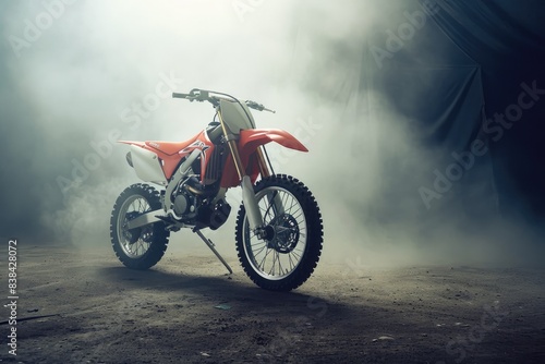 Speeding red dirt bike  dust-trailing rider  a person riding a dirt bike on a dirt road  Powerful dirt bike under dramatic studio lighting for an edgy effect