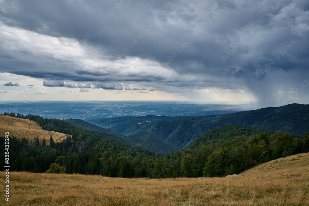 The sky is dark with very black clouds over the field on the Transalpina. Dramatic sky ready for the storm The sky is dark with very black clouds over the field on the Transalpina. Dramatic sky ready for the storm