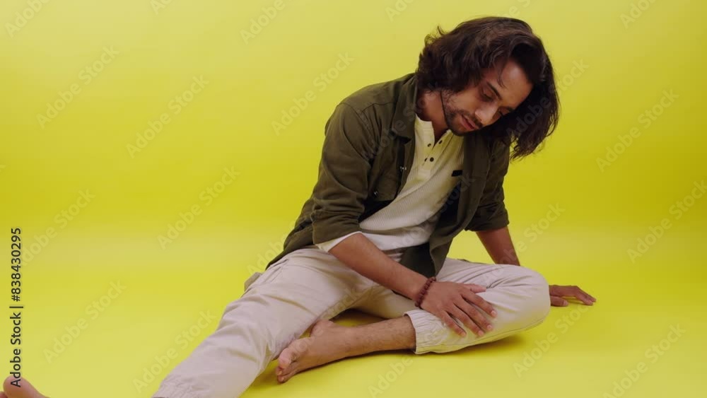 Man sitting desperate on floor Man sitting desperate on floor