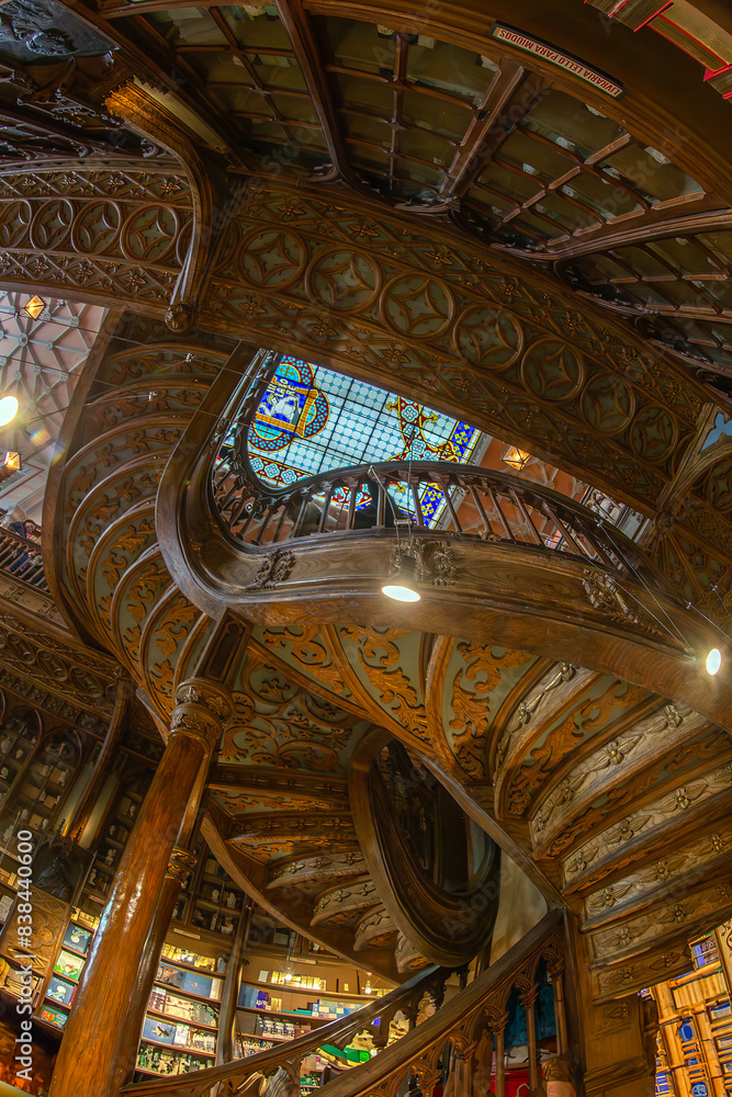 Fototapeta premium Interior of the Livraria Lello e Irmao, known as the Lello Bookshop, oldest in Portugal, dated from 1891, famous for Harry Potter film.Sumptuous interior wood staircase, Porto, Portugal