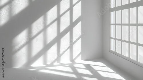 a minimalist depiction of a white wall with the shadow of a window,
