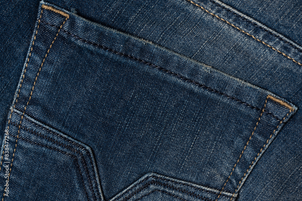 Blue jeans denim texture as a background. Top view. Blue jeans denim texture as a background. Top view.