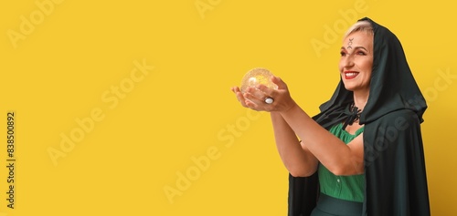 Mature witch holding crysta...