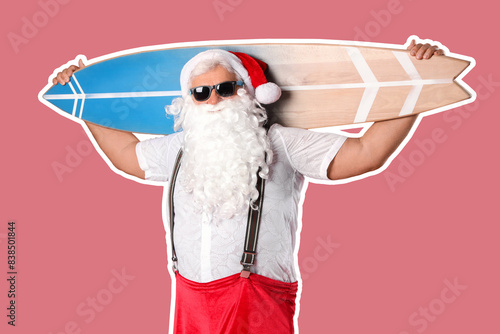 Santa Claus with surfboard on pink background. Christmas in July