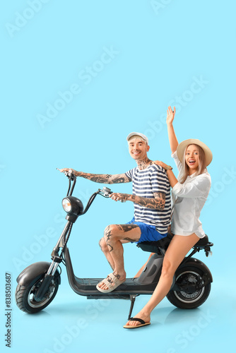 Young couple with electric ...