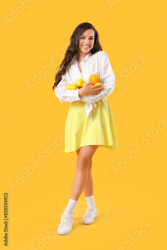 Pretty young woman holding ...