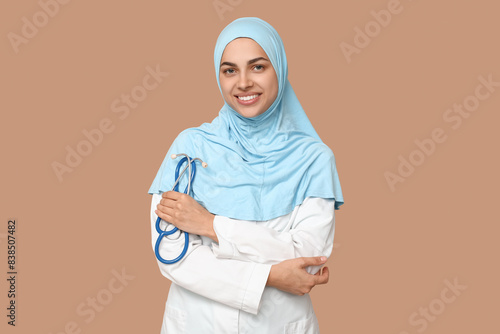 Smiling muslim female docto...