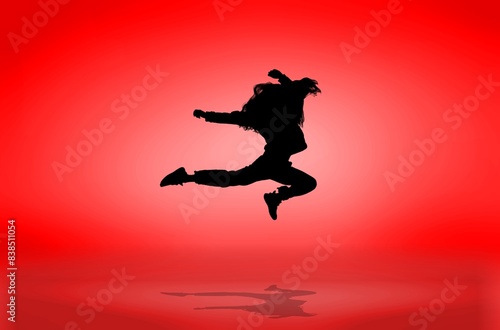Young Dancer silhouette Dancing on red background