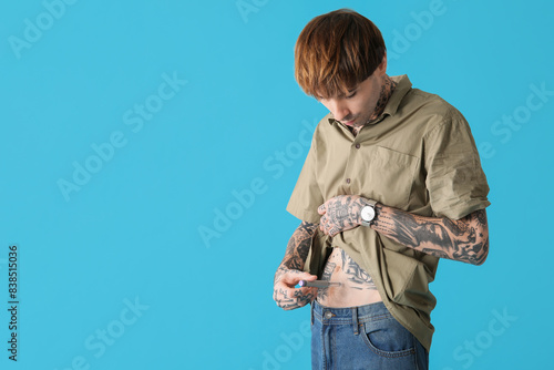Diabetic young man using la...