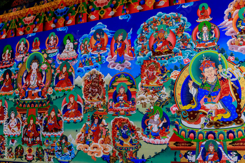 Wallpaper Mural Buddhist temple interior featuring ornate decorations, statues of buddha, and traditional architecture. Serene atmosphere with intricate details, golden accents, religious and cultural artifacts Nepal Torontodigital.ca