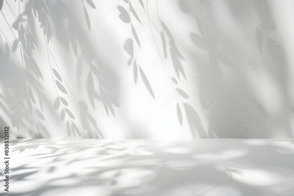 Minimalistic light background with blurred foliage shadow on a white wall. Beautiful background for presentation. Minimalistic light background with blurred foliage shadow on a white wall. Beautiful background for presentation.